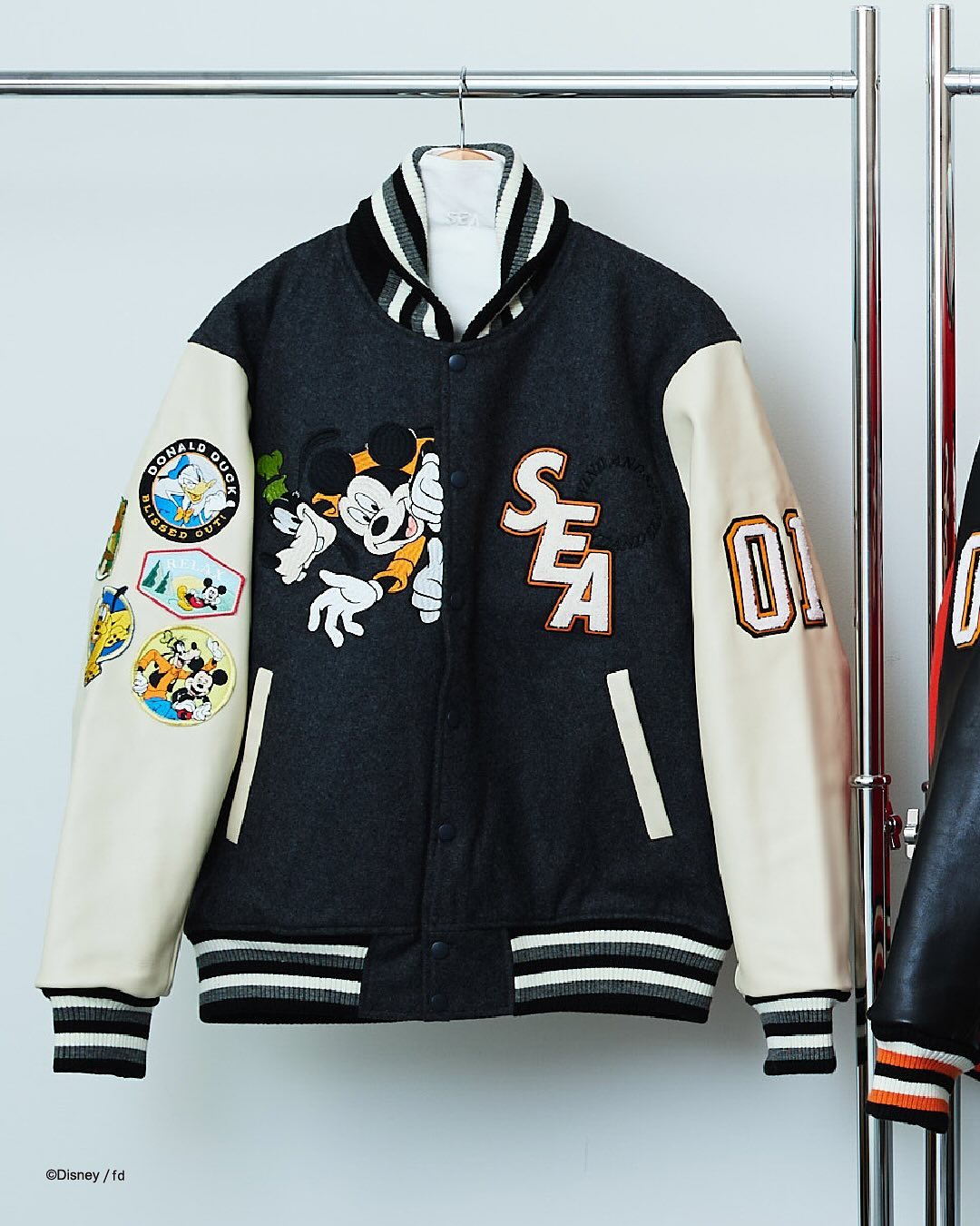32着限定】WIND AND SEA × Disney “NUMBERING STUDIUM JACKET” が2025