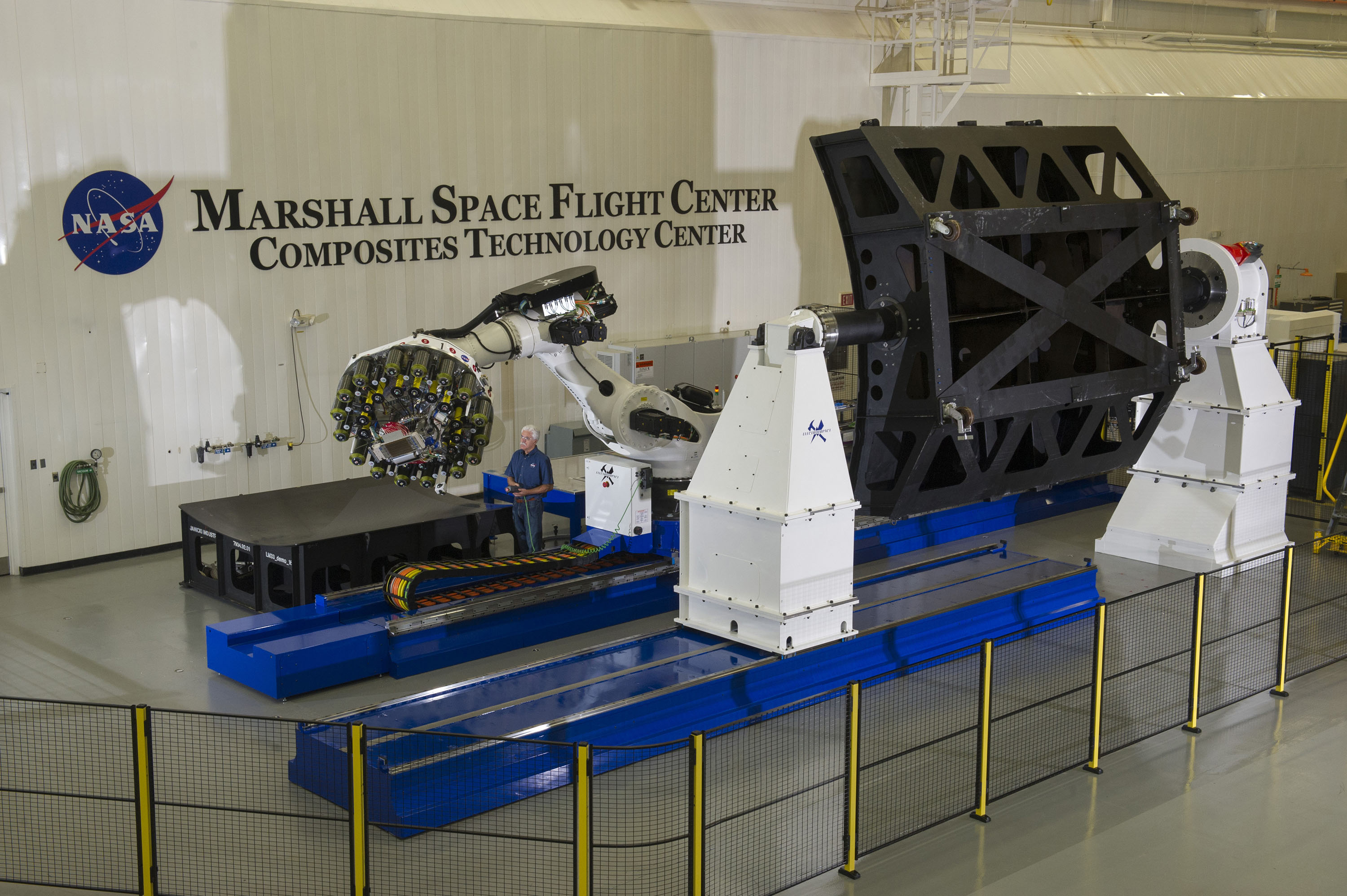 Robot Preparing To Build Large Light Composite Rocket Parts - NASA