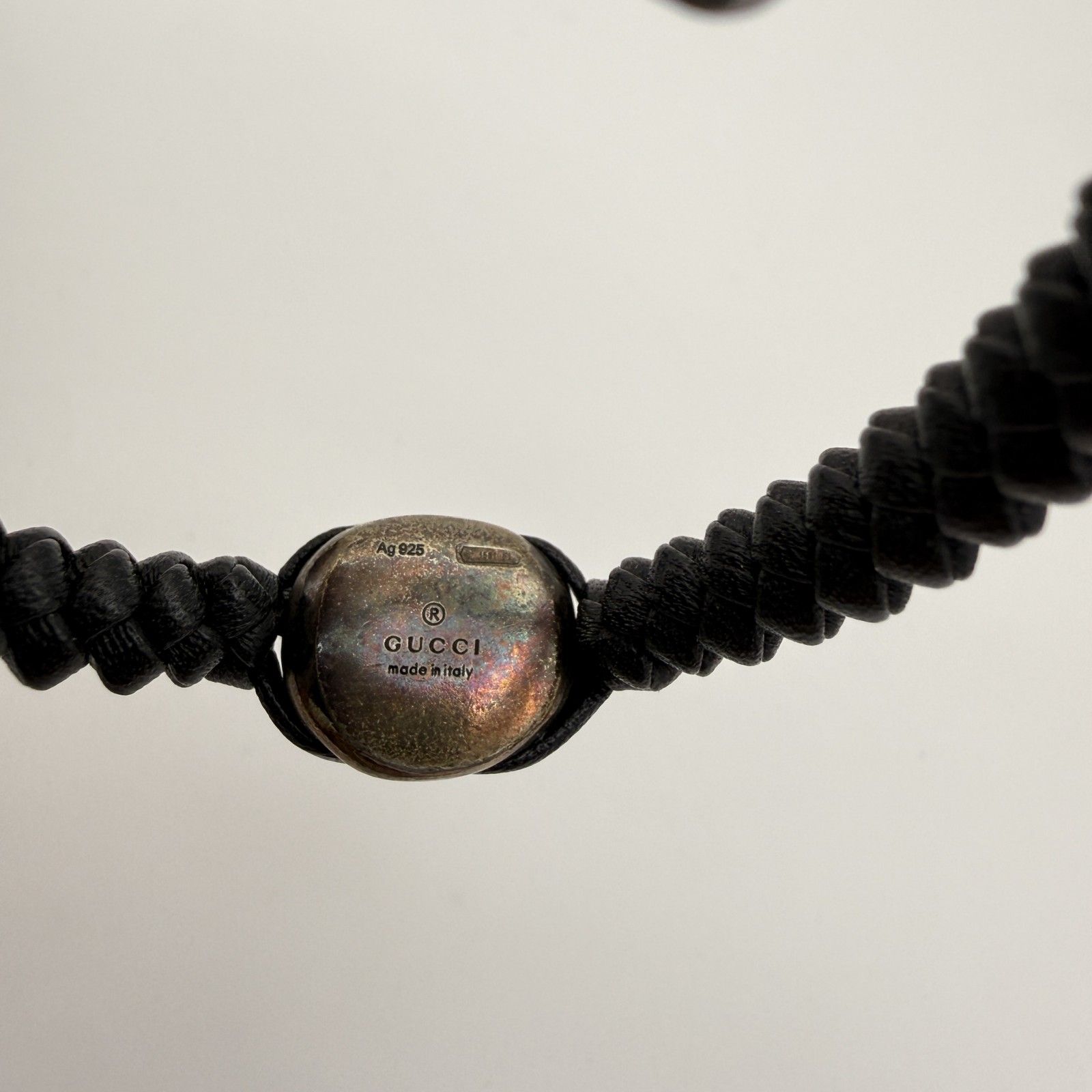 GUCCI（グッチ）クレストエンブレム 編み込みレザーブレスレット Ag925