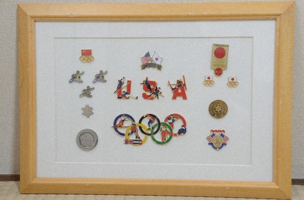 Olympic pin badge trader in Japan disappointed as overseas fans