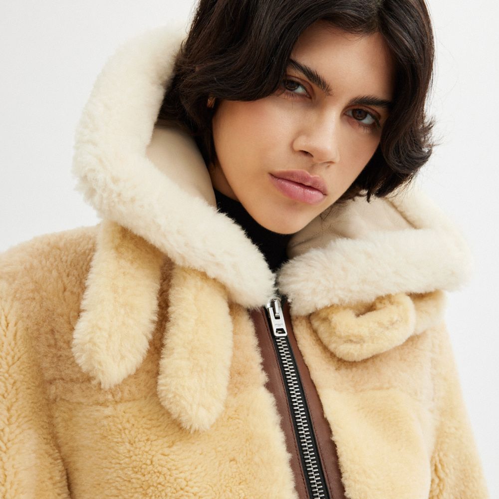 公式】COACH – コーチ | オール オーバー シアリング シュランケン