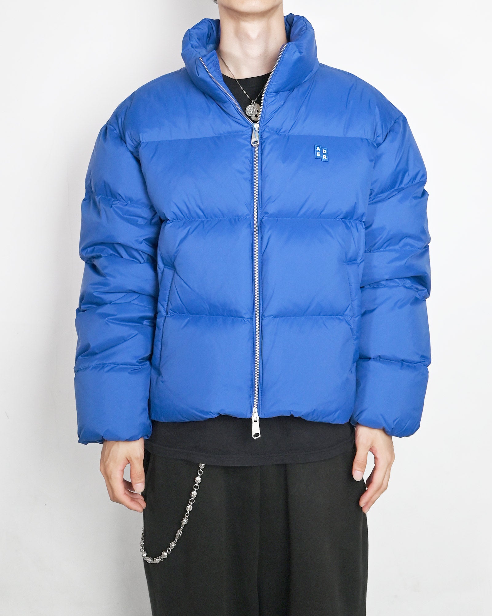 Ader Error(アーダーエラー)「 TRS TAG PUFFER JACKET 01 / BLUE
