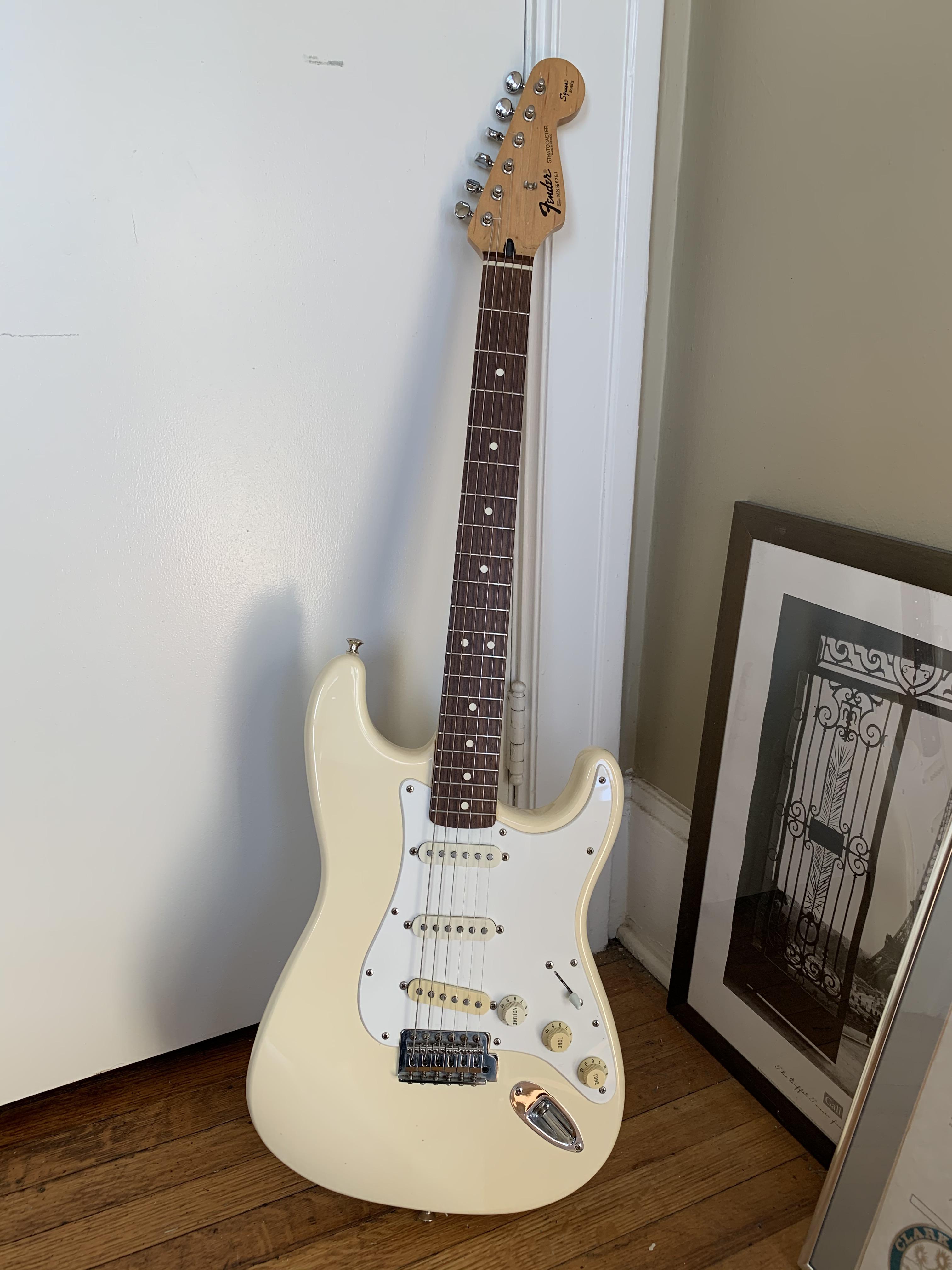 My first guitar, a 1996 Fender “Squier Series” MIM Stratocaster