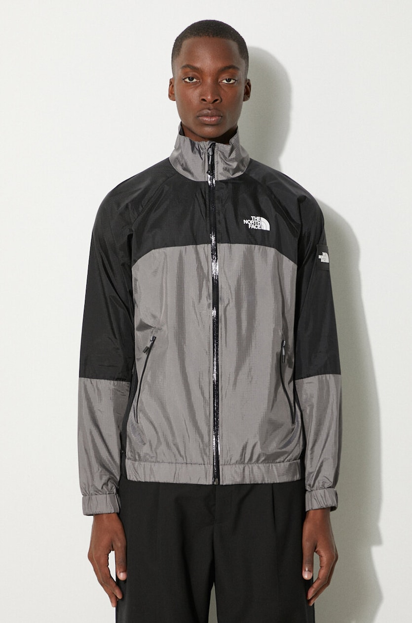 The North Face jacket Wind Shell Full Zip men's gray color