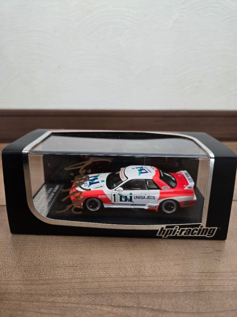 ユニシアジェックス GT-R 長谷見昌弘 直筆サイン入り 1/43 ミニカー