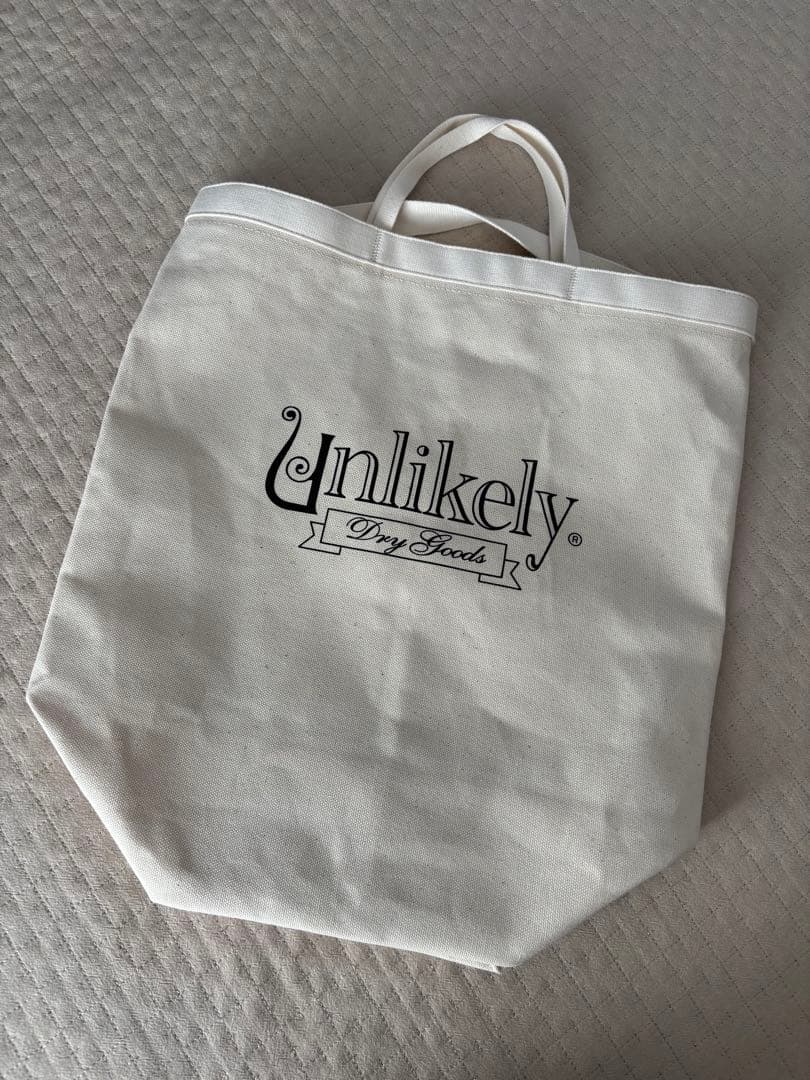 Nepenthes × Unlikely トートバッグ 15周年 HONEYEE.COM | Unlikely のスーベニアショップが NEPENTHES TOKYO に凱旋