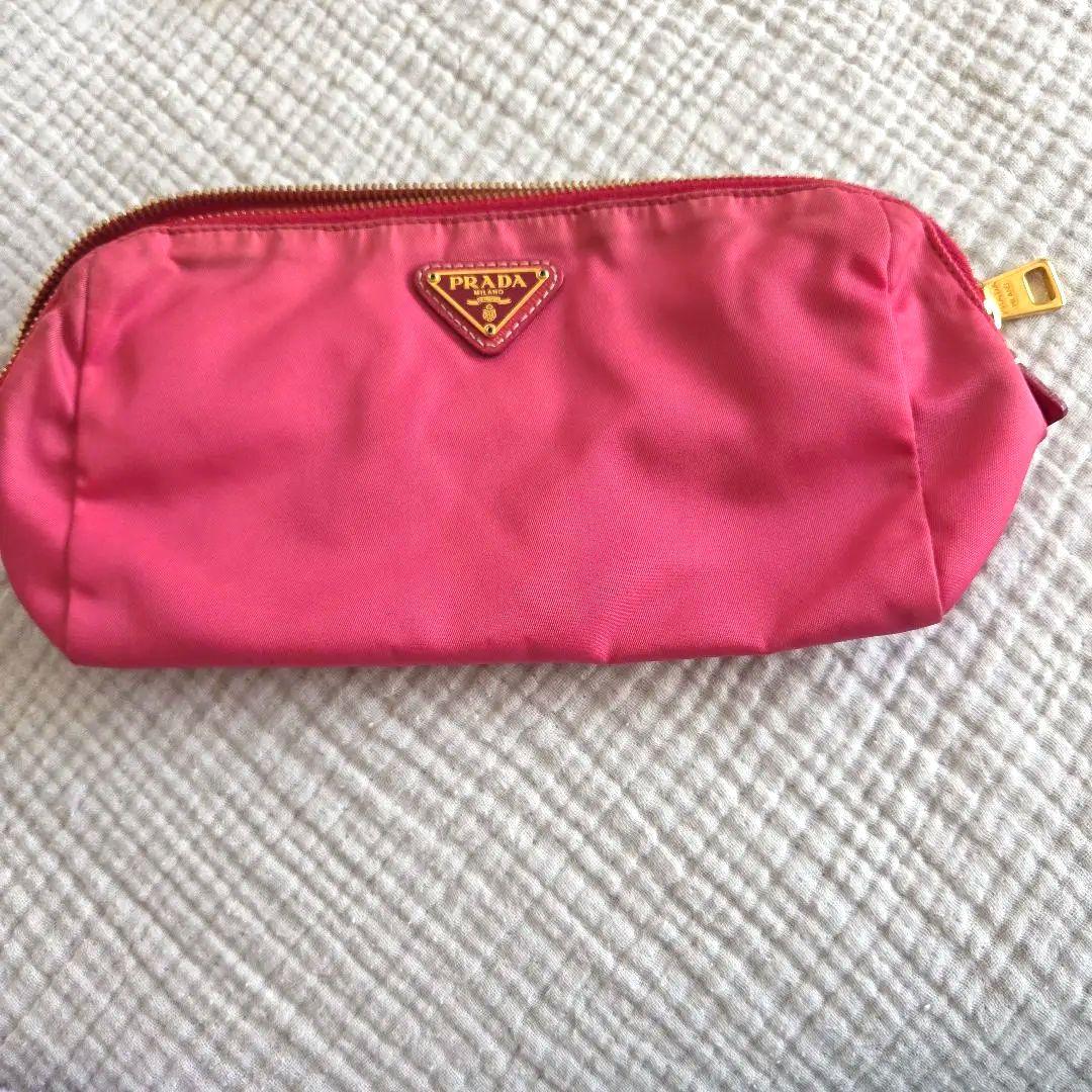 PRADA ピンク ポーチ 中古・古着通販】PRADA (プラダ) 巾着ポーチ ピンク｜ブランド・古着