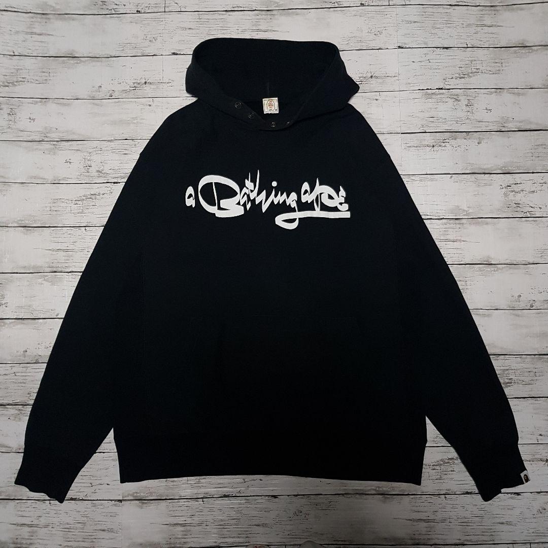 A A BATHING APE × FUTURA 筆記体ロゴパーカー アラビア