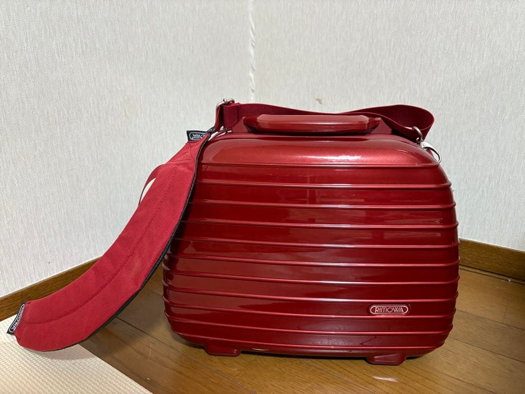 赤いストライプボストンバッグ フロージュ florge フラップダブルポケットのレザータッチボストン