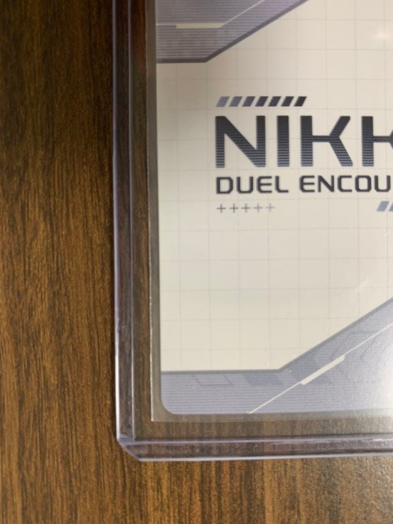 NIKKE DUEL ENCOUNTER 箔押しサインホロカードノワール＋おまけ - メルカリ