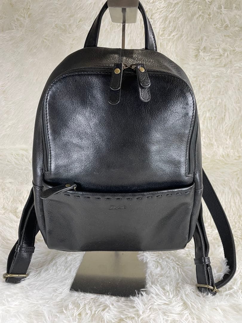 【美品】Dakota レザー ミニリュック ベルト 黒 Dakota（ダコタ） 3年保証＋プレゼント付 キャパレイン リュック