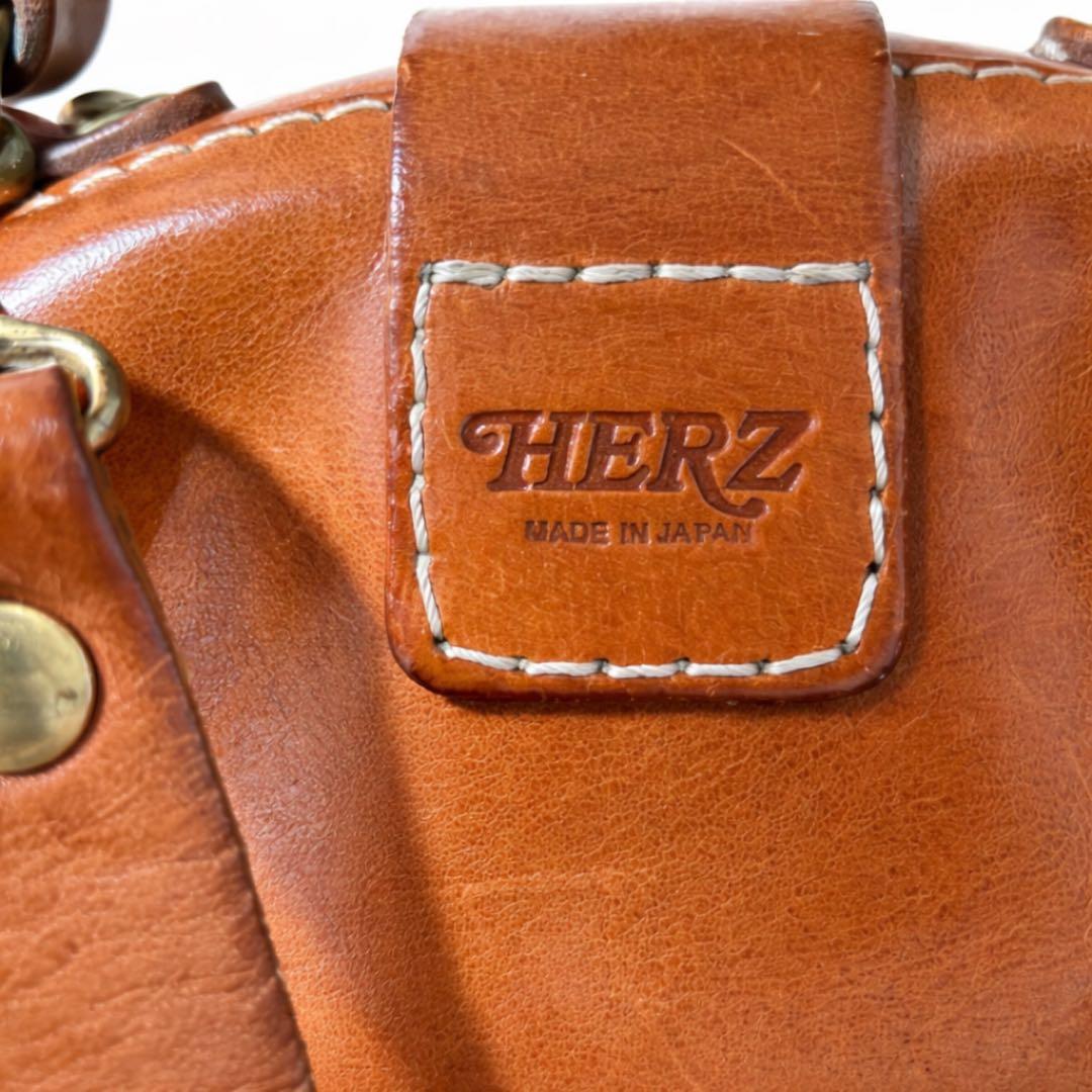 ヘルツ わんぱくリュック がま口 レザー バックパック ロック金具 鍵