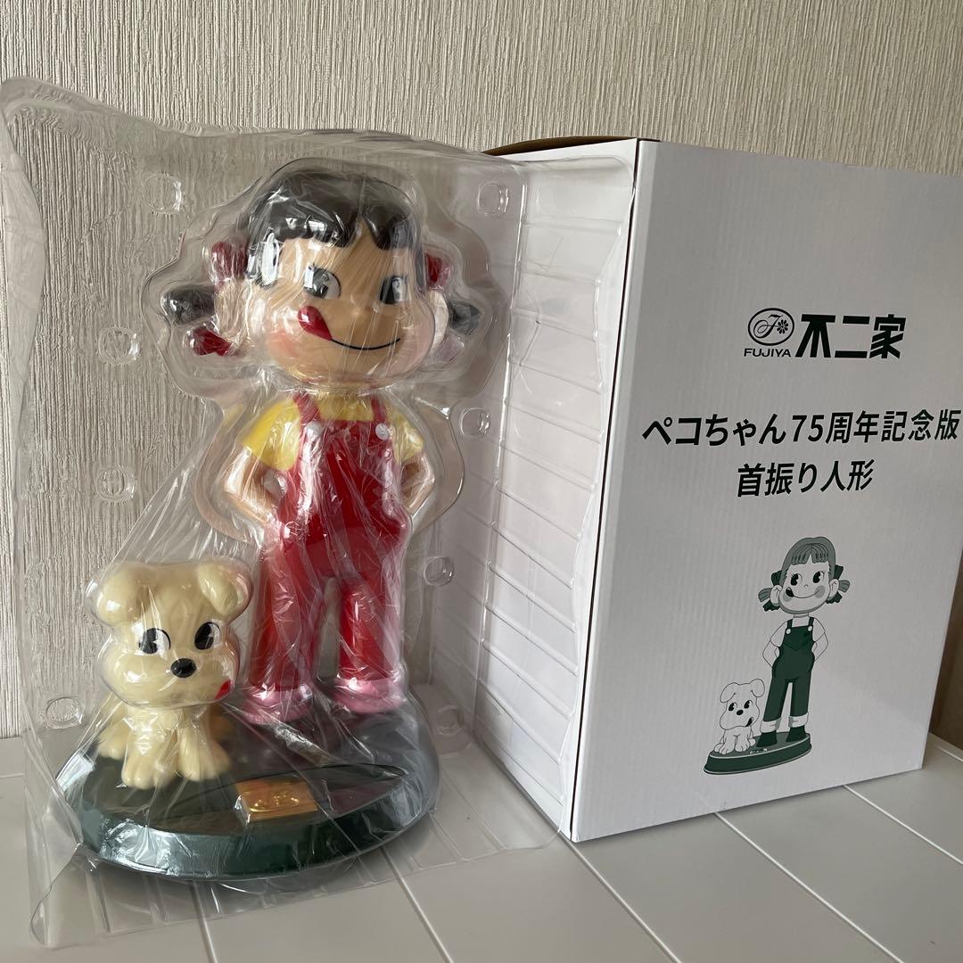 不二家 ペコちゃん75周年記念版首振り人形 - メルカリ
