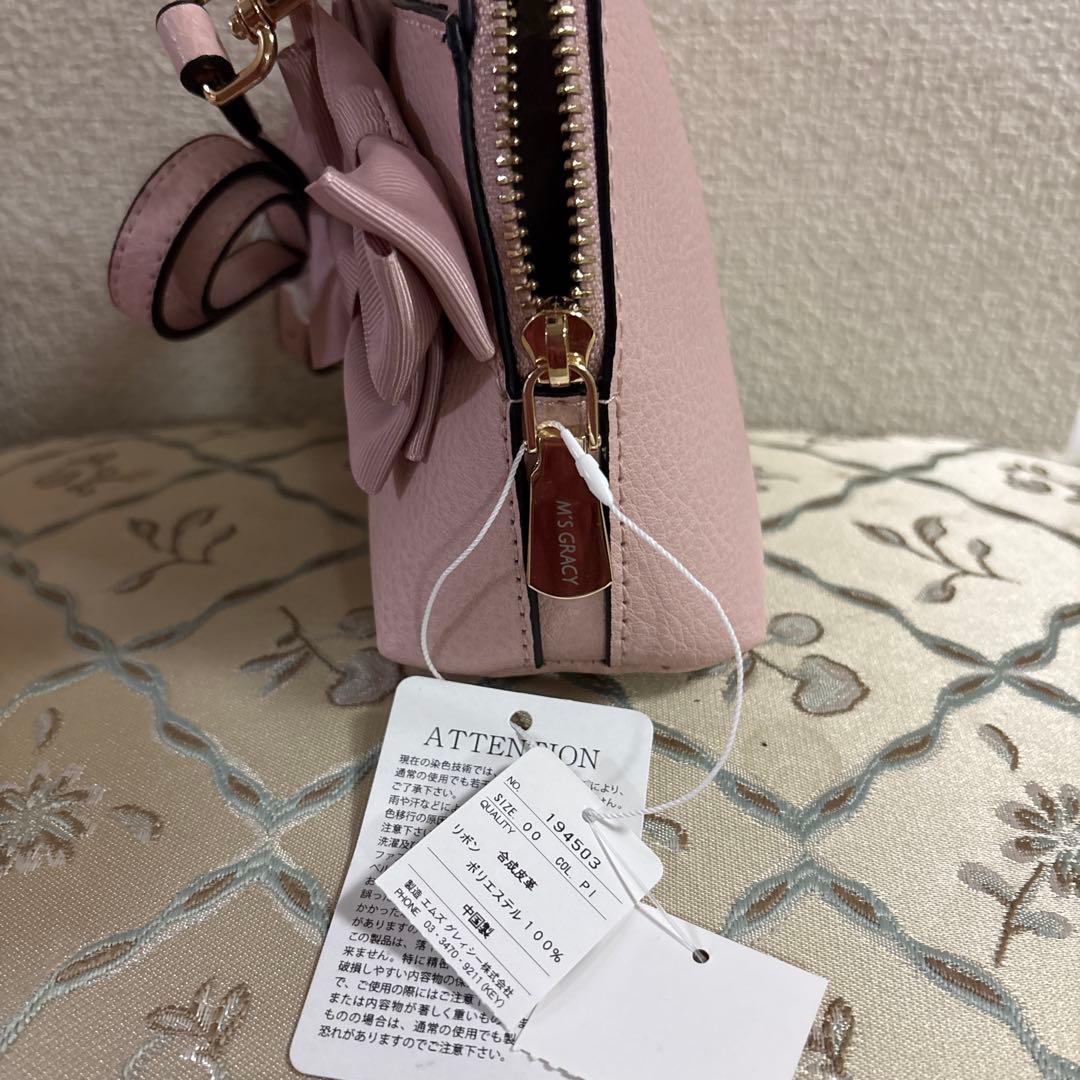 エムズグレイシーリボン付きピンクショルダーバッグ - メルカリ