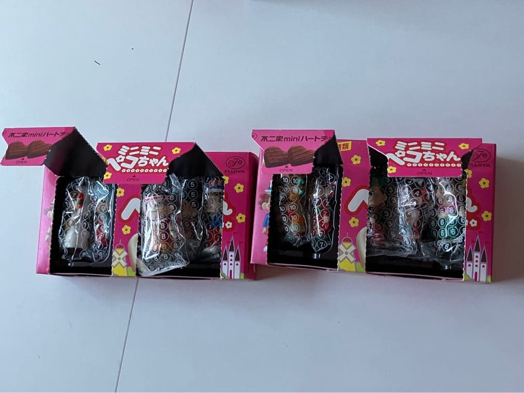 初代世界のペコポコ人形ミニミニペコちゃん 全種類 不二家 箱付 - メルカリ