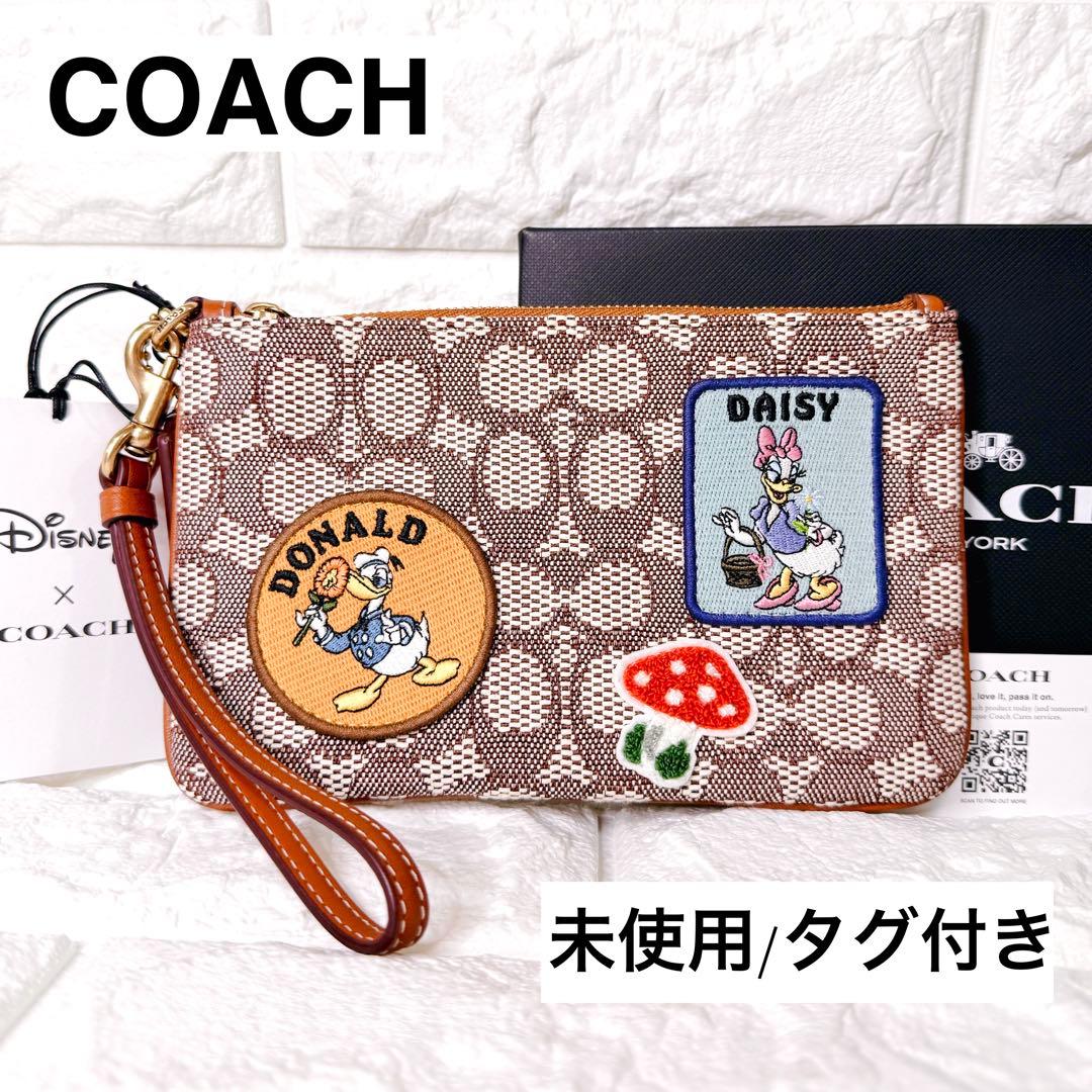 タグ付【未使用】COACH ポーチ シグネチャー ディズニー ドナルド デイジー