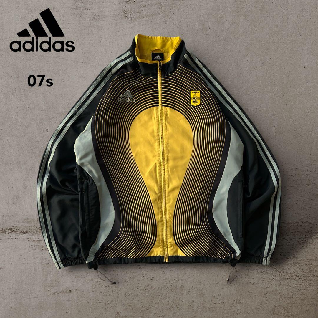 希少adidasアディダスARIS FCナイロンジャケットドローコード刺繍ロゴ adidas（アディダス） キッズ ジュニア 防水ジャケット スモールロゴ