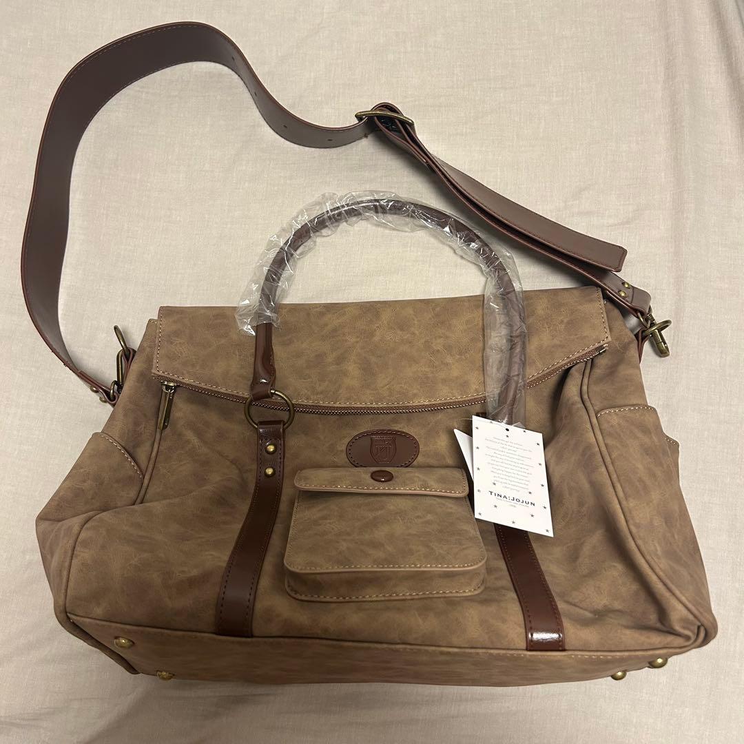 tina:jojun トラベルバッグ　新品未使用 TINA：JOJUN（ティーナジョジュン） ボストンバッグ ショルダー付き