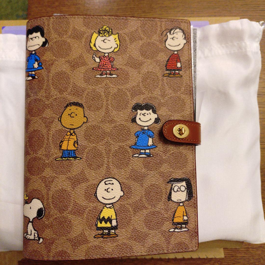 コーチ　スヌーピーコラボ　ノートブックシグネチャーキャンバス