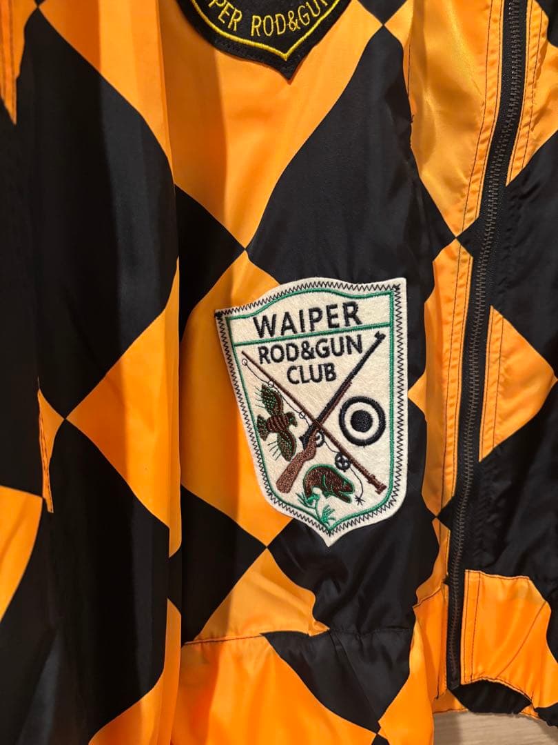 オレンジと黒のチェック柄ナイロンジャケット - メルカリ