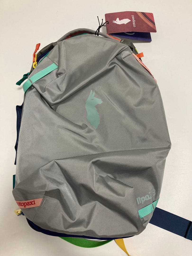 cotopaxi リュック グレー 赤 青 Cotopaxi Tasra 16L Backpack RD Del Dia (Mystery Colors) – Saratoga