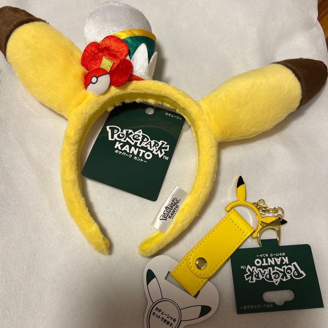 【新品未使用】ポケパークカントー　カチューシャ　カチューシャホルダー　ピカチュー 新品タグ付】ポケパークカントーピカチュウとイーブイのカチューシャ