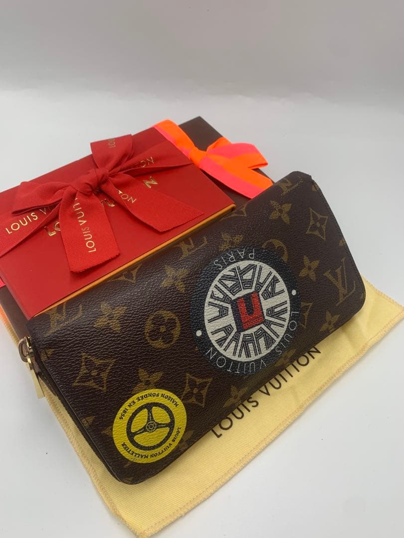 ルイヴィトン モノグラム ステッカー ジッピーウォレットコクリコ 長財布 P55