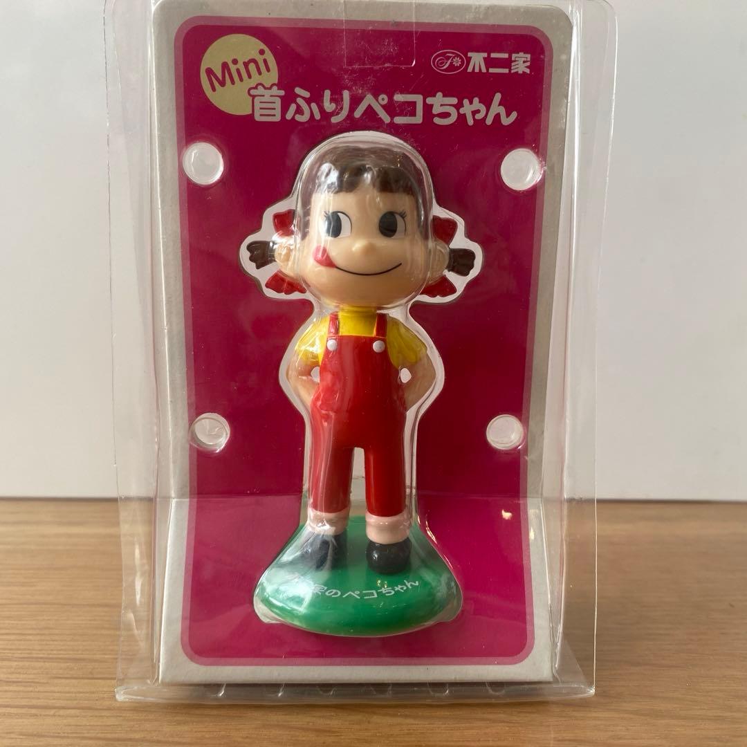 新品未使用！不二家 Mini 首ふりペコちゃん人形☆ - メルカリ