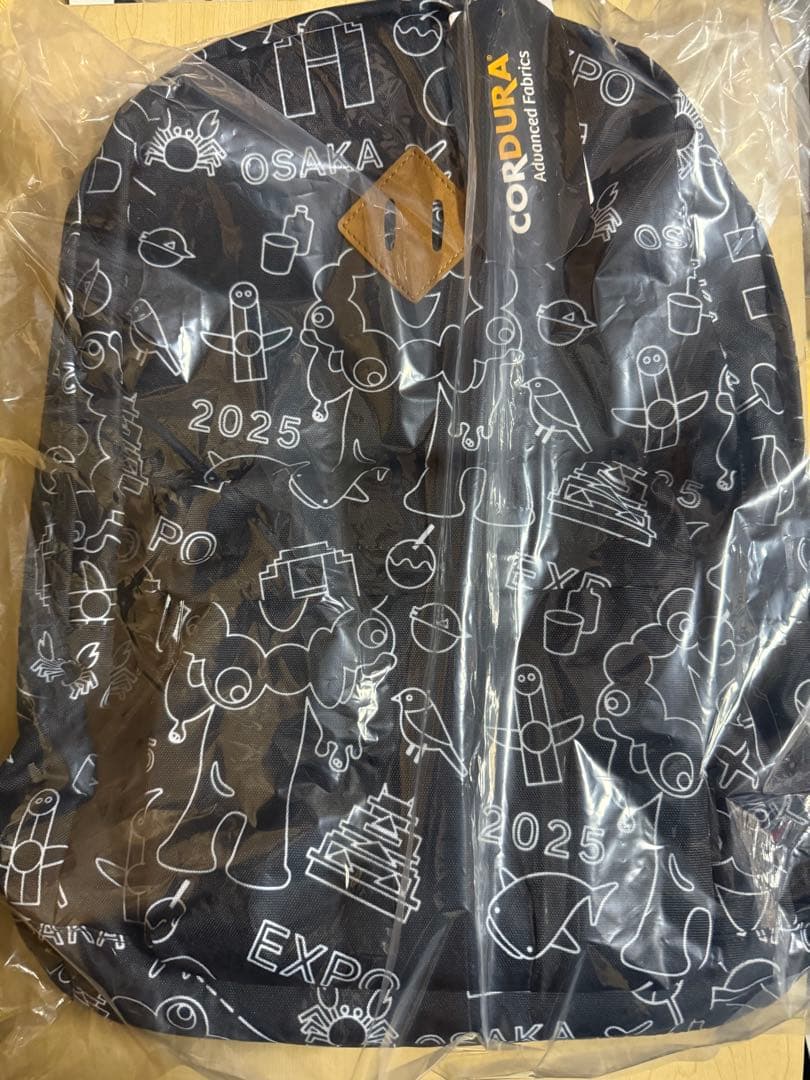 【最安値☆】大阪関西万博　ミャクミャク　リュックサック　総柄　ネオン柄 大阪・関西万博 ミャクミャク 総柄 CORDURA リュック 黒 大丸 EXPO2025