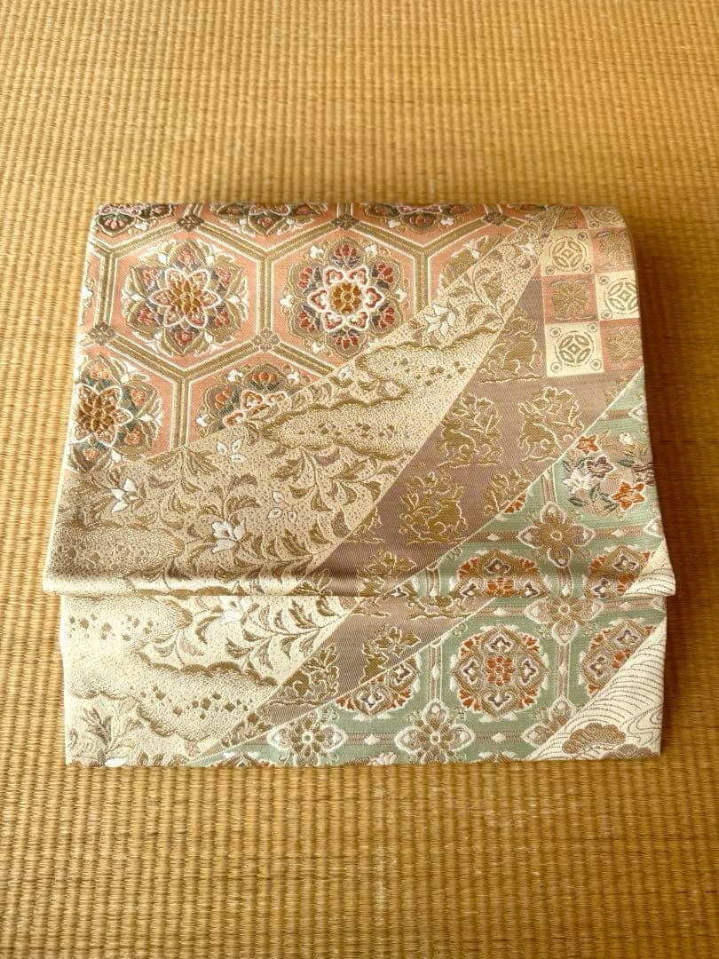 袋帯　花亀甲繋ぎと流水に古典草花文 帯のアトリエ花邑 hanamura 銀座「野の草花文様 型染め 絽 名古屋帯」