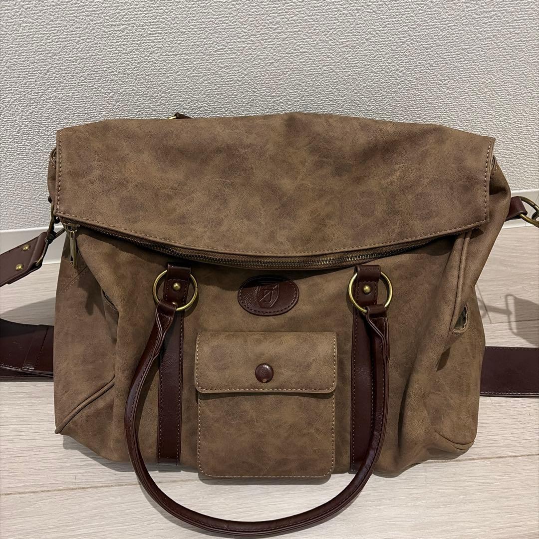 TINA：JOJUN ショルダー付きトラベルバッグ - メルカリ