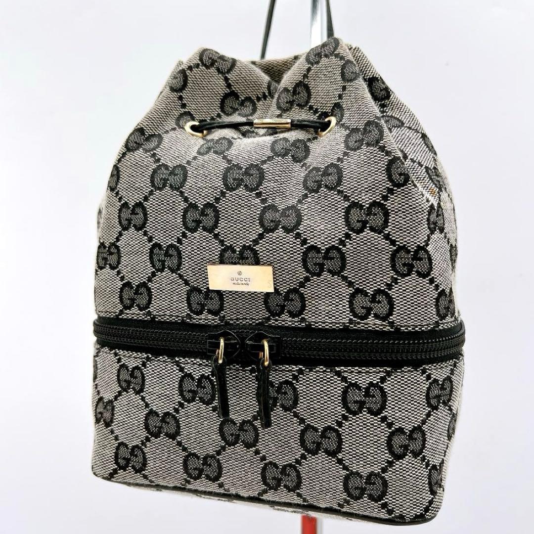 良品 GUCCI GGキャンバス プレート バニティポーチ 巾着 e650