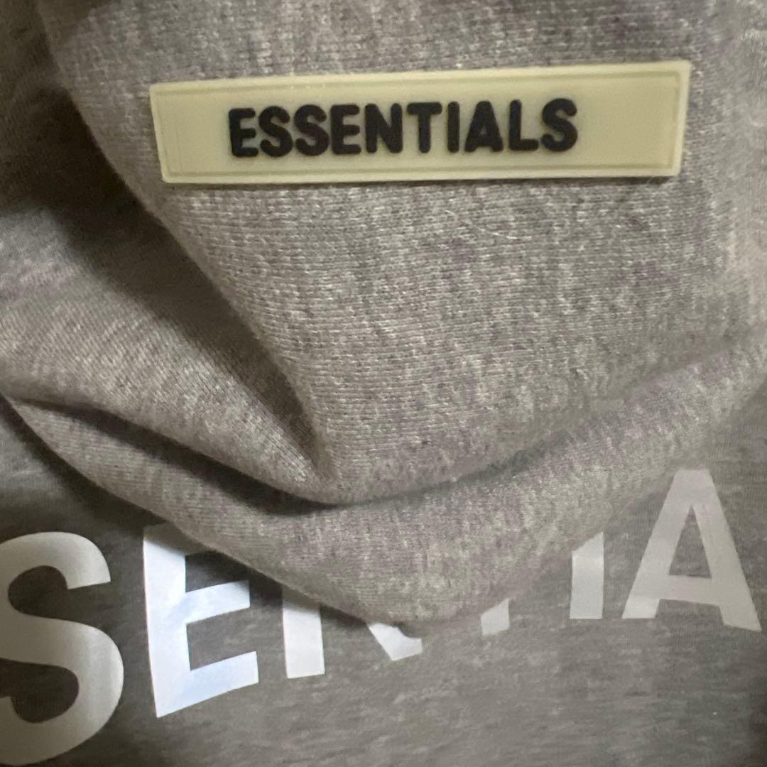 ESSENTIALS グレー フード付きパーカー - メルカリ