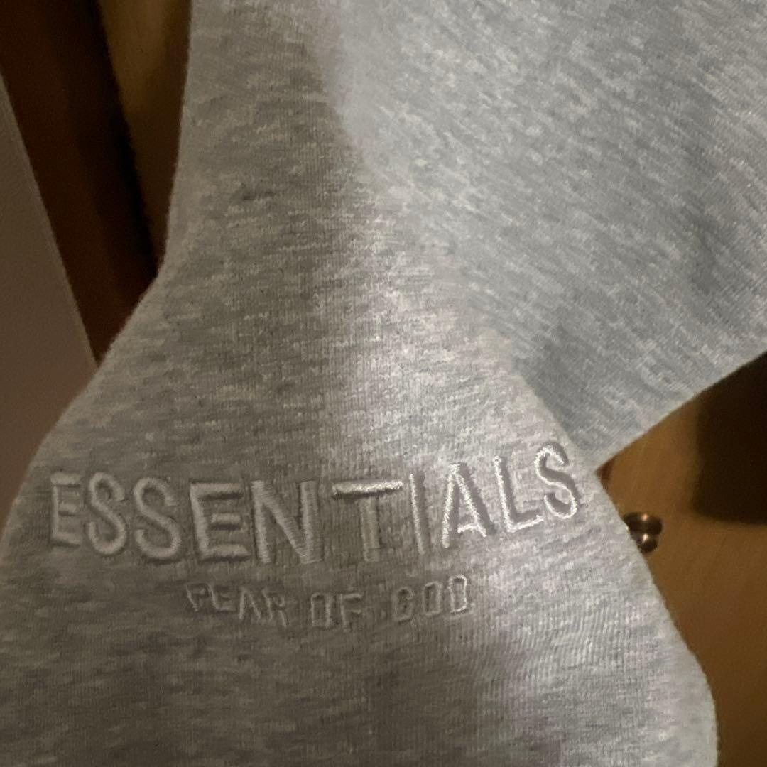 ESSENTIALS グレー フード付きパーカー - メルカリ