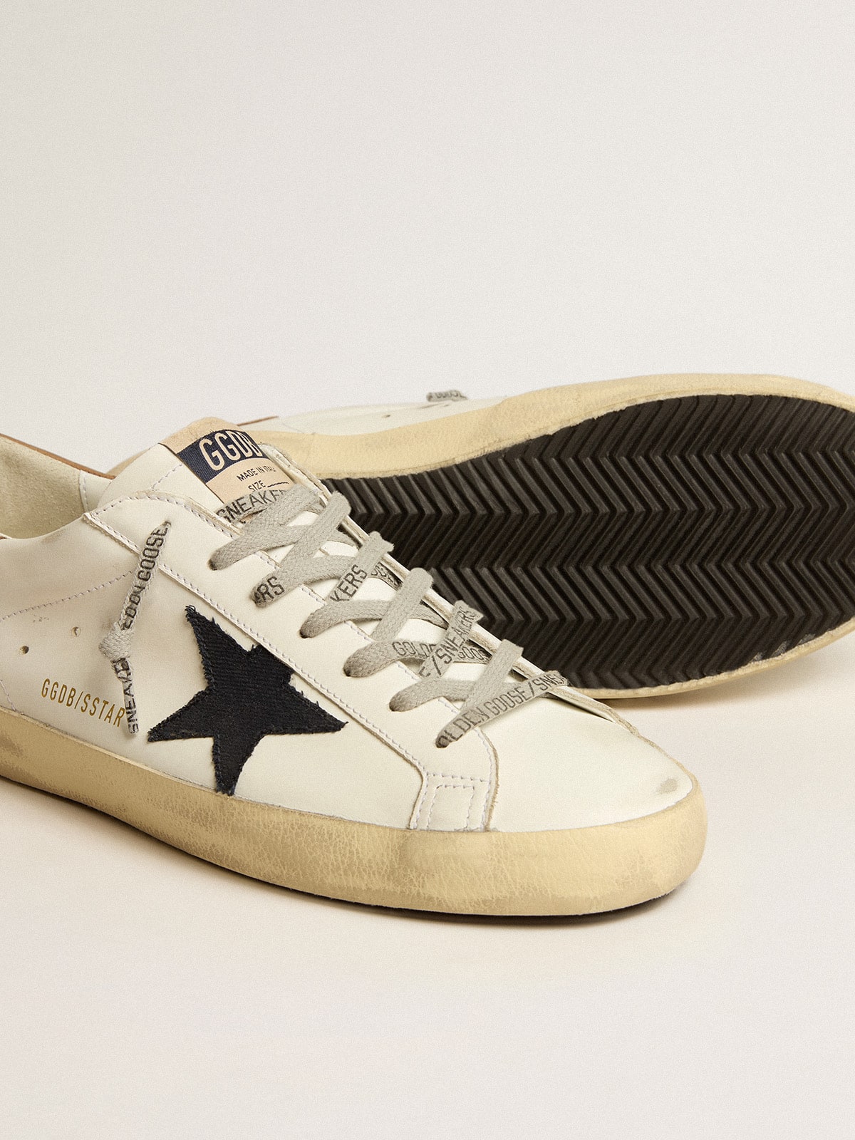 Men's Super-Star in white leather with midnight-blue canvas star